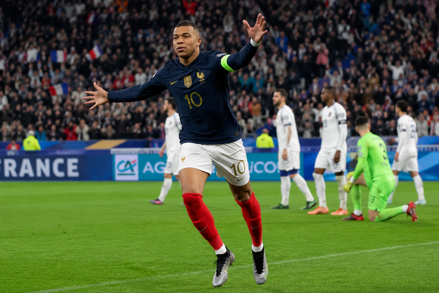 France national team players warming up during a training session before a FIFA World Cup Round of 16 match.